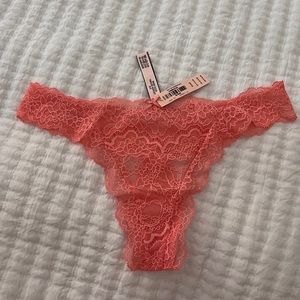 Victoria Secret dream Angel thong string. Size small coral color lace thong